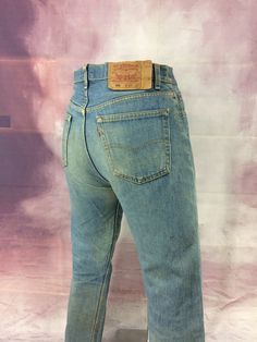 "Size 33 Vintage 1990s Levi's 501 Button Fly Jeans High-Waisted Straight Leg Jeans Distressed Ripped Dirty Denim Jeans - Made In USA, waist 33\" Brand: LEVIS 501 Size On Tag marked W33 L32 but fits more like 33\" waist, 12.5\" rise, 25\" thighs, 26.5\" hip, 45\" hips, 30.5\" inseam, 16\" leg opening! Fits a size 33, but check your measurements and compares the measurement with your garment. (see full measurement below) Recommended waist size: 33\" (33x30.5) Material : Cotton 100% Made In USA NOT Fitted Faded Selvedge Bottoms, Vintage Fitted Jeans With Button Closure, Vintage Light Wash Jeans With Belt Loops, Vintage Mid-rise Jeans With Buttons, Faded Vintage Fitted Jeans, Fitted Vintage Faded Jeans, Vintage Light Wash Fitted Bottoms, Vintage High Rise Bottoms With Buttons, Vintage High Rise Button Jeans