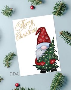 a christmas card with an image of santa claus holding a tree and the words merry christmas on it