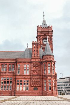 an old red brick building with a clock tower