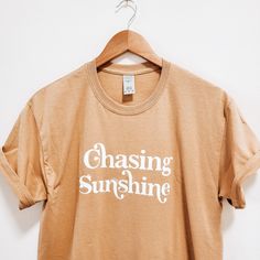 Get out there and ﻿chase sunshine in this perfect simple boho vibe t-shirt for the summer. Boho Quotes, Quote Tshirts, Gold Shirt, Positive Shirt, Retro Designs, Boho Vibe, Cute Tshirts, Graphic Tees Women, Spring Summer Fashion