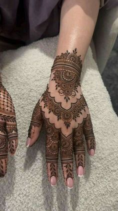 henna tattoo on the hands of a woman