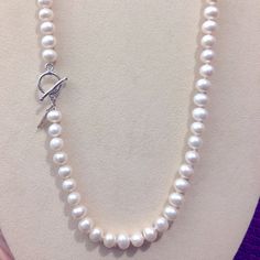 Stunning 18” White Pearl Strand Never Worn With A Sterling Circle Toggle Closure. Classic Pearl Necklace With Toggle Clasp, White Pearl Necklace With Toggle Clasp, Adjustable White Necklace With Toggle Clasp, White Round Necklace With Toggle Clasp, White Round Necklaces With Toggle Clasp, Adjustable Pearl Necklace With Lobster Clasp, Classic Adjustable Necklaces With Sterling Silver Clasp, Formal Toggle Necklace, Elegant Round Toggle Necklace Adjustable