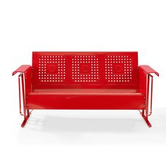 a red metal bench sitting on top of a white floor