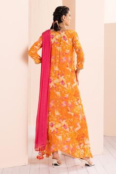 Saffron misty femme tunic with abstract print and thread and mirror embroidered neckline and sleeves. Comes with dhoti pant and a dupatta.
Components: 3
Pattern: Printed, Embroidered
Type Of Work: Abstract, Thread, Mirror
Neckline: V Neck
Sleeve Type: Three quarter
Fabric: Viscose crepe, Chiffon
Color: Orange
Other Details: 
Tasseled detailing on kurta and dupatta
Occasion: Sangeet - Aza Fashions Silk Maxi Set With Sheer Dupatta, Unstitched Maxi Length Palazzo Set With Sheer Dupatta, Unstitched Bollywood Style Palazzo Set Maxi Length, Bollywood Style Orange Palazzo Set With Straight Kurta, Silk Maxi Length Palazzo Set For Eid, Diwali Maxi Length Churidar, Maxi Length Dupatta With Dabka Details, Maxi Length Dupatta With Dabka, Navratri Palazzo Set With Sheer Dupatta