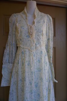 "Gunne sax style or possibly Gunne Sax prairie dress. Zippers at the wrists. Laces at the bust. Good condition - has sewn on back under the laces that could be easily removed - see last photo. Measurements taken across front laid flat 17.5\" across front armpit to armpit 13.5\" across front of waist (ties tighter) 20\" across hips 59\" length" Pastoral Prairie Dress With Ruffles For Spring, Spring Pastoral Prairie Dress With Ruffles, Pastoral Prairie Dress For Spring Garden Party, Spring Pastoral Prairie Dress For Garden Party, Spring Pastoral Dress With Lace Trim, Pastoral Lace Trim Dress For Spring, Fitted Long Sleeve Victorian Dress For Spring, Spring Long Sleeve Prairie Dress In Cottagecore Style, Spring Long Sleeve Cottagecore Prairie Dress