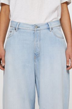 2023 jeans are cut to a super baggy fit with a mid waist, super wide leg and long length. Crafted from non stretch denim in a mid blue wash. Acne Studios 2023F FN Ice Blue Baggy High-rise Flare Jeans In Rigid Denim, High-rise Baggy Flare Jeans In Rigid Denim, High Rise Baggy Flare Jeans In Rigid Denim, Oversized Straight Leg Rigid Denim Bottoms, Oversized Light Wash Wide Leg Bottoms, Oversized High Rise Light Wash Bottoms, Oversized Wide Leg Jeans With Five Pockets, Oversized Medium Wash Wide Leg Bottoms, Wide Leg Cropped Jeans For Streetwear