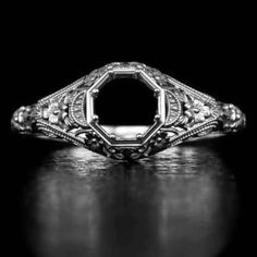 Featured here is a beautiful filigree semi-mount that is a memento of the Art Deco period! This ring is made from a mold of an original vintage piece that we have. It was one of the few rare pieces we have found with very intricate filigree and great detail. The design is timeless and as soon as we saw the original, we fell in love with the ring. The original piece was made in the 1920's and has all of the classic vintage details. The intricate filigree and engraving detail is beautiful! This looks truly like the original vintage piece as the mold was made from the old model. The pictures do not do justice to this piece because in real life you can see all of the small details together and really appreciate the rare early 1900's character of it. We certainly recommend a first hand look. Th Antique Engraved Ring With Intricate Design For Ceremonial Use, Antique Ceremonial Ring With Intricate Design, Antique Engraved Ring For Ceremonial Occasions, Ornate Diamond-cut Filigree Ring, Antique Engraved Platinum Jewelry, Ornate Round Engraved Ring, Classic White Gold Intaglio Engraved Ring, Diamond Intaglio Jewelry, Classic White Gold Engraved Ring With Intaglio