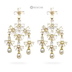 Elevate your elegance with our White Moonstone Chandelier Earrings, adorned with delicate Freshwater Pearl Drops. Expertly crafted in 925 Sterling Silver and adorned with natural gemstones, these exquisite earrings offer a fusion of sophistication and charm. The gold-plated design adds a touch of luxury, making them the perfect accessory to grace special occasions or accentuate your daily style. Immerse yourself in the enchanting allure of moonstone and the timeless beauty of pearls, all intricately set in a designer masterpiece that radiates grace and allure. CATEGORY : Chandelier Earrings STYLE : Contemporary METAL : 925 Sterling Silver GEMSTONES / DECORATIONS : Natural White Moonstone and natural Fresh Water Pearls. GROSS WEIGHT : 44 gms apx. DIMENSION : Length - 3.46 Inch (8.8 cms) , W Elegant Pearl Drop Chandelier Earrings For Reception, Elegant White Pearl Earrings For Reception, White Pearl Drop Earrings For Reception, White Pearl Drop Bridal Earrings For Reception, White Chandbali Pearl Earrings For Formal Occasions, White Elegant Bridal Earrings For Reception, White Chandbali Pearl Earrings For Reception, Elegant White Bridal Earrings For Reception, White Chandbali Bridal Earrings For Reception