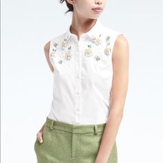 Perfection! New With Tags Banana Republic Riley Top With Embellishment. This Piece Is Hard To Find. Absolutely Gorgeous. White With Multicolor Embellishment. Size 8. 96% Cotton 4% Spandex. Did I Mention Nwt? Chic White Top With Embellished Collar, Embellished Summer Blouse For Work, White Top With Embellished Collar For Work, Fitted Floral Summer Tops, Fitted Floral Embellished Summer Tops, Fitted Floral Embellished Tops For Summer, Spring Fitted Tops With Embellished Collar, Chic Spring Embellished Blouse, Fitted Spring Tops With Embellished Collar