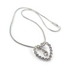 Vintage, Clear Rhinestone, Heart Pendant, Necklace, Chain, Silver Tone. Size - Chain 15.25" Condition - Dark / yellowing stones. Some wear. Good vintage condition. FREE SHIPPING TO USA - on orders of $35.00usd ($48.00cad) or more (No coupon code needed) FREE SHIPPING TO CANADA - on orders of $92.00usd ($125.00cad) or more (Please use coupon code FREESHIP125) FREE SHIPPING INTERNATIONAL - on orders of $146.00usd ($200.00cad) or more (Please use coupon code FREESHIP200) Chain Silver, Rhinestone Heart, Code Promo, Clear Rhinestones, Necklace Chain, Heart Pendant Necklace, Coupon Code, Heart Pendant, Pendant Necklaces