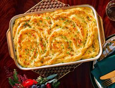 a casserole dish with cheese and herbs