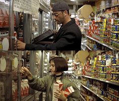 a man and woman looking at canned food in a grocery store, both holding boxes