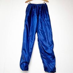 Vintage 90s Royal Blue Straight Leg Track Pants with front & back pockets  100% polyester Made in Taiwan Excellent vintage condition Women's Size Large Measurements taken flat laid across the front  Approximate measurements: elastic waistband - 16, hips - 23, rise - 14, inseam - 30, leg opening - 8 Totally rad! ::Q8384 90s Style High Waist Blue Pants, 90s High Waist Blue Pants, 90s Style Blue Nylon Bottoms, Blue Full-length Nylon Pants, 90s Style Blue Bottoms With Relaxed Fit, Blue Full-length Pull-on Pants, 90s Style Blue Bottoms With Pockets, 90s Blue Bottoms With Pockets, Blue Full Length Pants With Pull-on Style