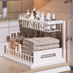 a bathroom shelf with towels, soaps and lotions