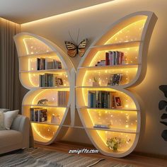 a butterfly shaped book shelf with books on it's sides and lights in the middle