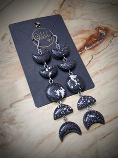 the black and white earrings are on display