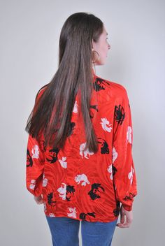 "Flowers print women retro red long sleeve blouse, Size XL Welcome to TARASCOMMON.ETSY.COM Unique clothing from the 20th century. Model tall - 170cm XL. Sleeve - 40cm / 15.74inch; ( armpit to end of sleeve); Width - 60cm / 23.62inch; Length - 65cm / 25.59inch. All measurements are taken seam to seam while lying flat. This item is vintage, so it can have some defects. Additional photos can be send We are glad that you are interested in lots that we sell. Wish you a good shopping! FOLLOW US : Inst Vintage Printed V-neck Blouse, Red Graphic Print Blouse For Fall, Red Long Sleeve Top With All Over Print, Red Printed V-neck Blouse, Printed Long Sleeve Blouse For Fall, Red Long Sleeve Top With Graphic Print, Vintage All-over Print Top For Spring, Red Long Sleeve Blouse For Summer, Vintage Red Long Sleeve Top