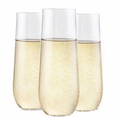 three champagne flutes filled with liquid on a white background