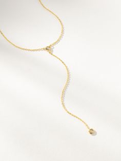 The dainty lariat of your dreams features two small circular stones and is called Little Things Lariat Necklace. This gold necklace is perfect for everyday wear on its own or layered with some of your favorites. Our stylists love layering this long gold necklace with our Level Up Necklace and Touch of Pink Necklace. | Dainty Gold Little Things Lariat Drop Necklace | Women's Jewelry by Uncommon James Adjustable Round Lariat Necklace In Dainty Style, Adjustable Dainty Round Lariat Necklace, Adjustable Delicate Chain Lariat Necklace, Adjustable Round Lariat Necklace With Delicate Chain, Adjustable Dainty Lariat Necklace For Layering, Dainty Round Lariat Necklace With Delicate Chain, Long Gold Necklace, Uncommon James, Gold Lariat Necklace