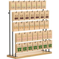 a wooden display with earrings on it