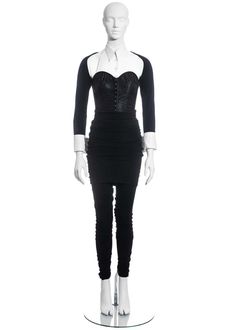 For Sale on 1stDibs - ▪ Dolce & Gabbana black corset suit ▪ Satin corset with attached white cotton shirt collar and cuffs ▪ Internal boning ▪ Wool jersey sleeves ▪ Extra long Fitted Long Sleeve Corset, Vintage Fitted Corset For Fall, Gothic Fitted Long Sleeve Corset, Gothic Long Sleeve Fitted Corset, Black Fitted Corset For Fall, Fitted Overbust Corset For Fall, Black Fitted Long Sleeve Corset, Black Corset Suit, Corset Suit