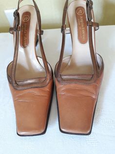 "Vtg tawny, tan brown (with bronze straps) leather women leather slingback shoes. Summer shoes with the 90s square toes and angular block heels (gold color bottoms). EU size 37. Made in Italy. Comfy footwear.European quality. condition: normal condition. A little used, some signs of wear. Shabby bottom soles. Heels height 8,2 cm / 3.2\" in approx. outsole length- 27,4 cm / 10.7\" in size: EU 37 - labeled size; US 6.5" Leather Slingback Pumps With Square Toe, Vintage Leather Slingback Pumps For Spring, Spring Vintage Leather Slingback Pumps, Brown Leather Heels With Square Toe, Brown Square Toe Heels With Leather Sole, Vintage Leather High Heel Slingback Pumps, Vintage Leather Slingback Pumps With Heel Strap, Vintage Leather Slingback Pumps, Retro Leather Slingback Heels