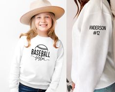 Baseball sister sweatshirt with last name and jersey number All sweatshirts are made with a lightweight unisex style pullover.  The toddler sizes run from 2T to a size 7 and they are Rabbit Skins brand.  The 5/6 tends to fit a little more closely to a 6 in my experience.  The youth sizes are made with Gildan brand sweatshirts and run from youth small to youth XL. SHIPPING: All orders will be shipped using USPS ground shipping (2-5 business days) unless you have upgraded. I always aim to get your Personalized White Tops For Game Day, Personalized Sporty Tops For Sports, Sporty Personalized Tops For Sports Events, Sporty Personalized White Top, Personalized Crew Neck Sports Top, White Personalized Sporty Top, Varsity Sweatshirt With Team Name For Baseball Season, Team Name Sweatshirt For Baseball Season, Casual Personalized Tops For Baseball Season