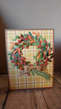 a handmade card with a wreath on it