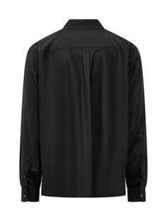 Dolce & Gabbana’s black virgin wool tailored shirt featuring a pointed collar, buttoning at the front and cuffs, buttoned flap chest pockets, logo label on the left pocket and straight hem.Gender: MENMaterial: WOOL OR FINE ANIMAL HAIR->VIRGIN WOOL100 %Color: BlackMade in: ITProduct ID: G5MD1TFU21QN0000*Import tax/duty will be calculated at checkout (If applicable) Classic Black Tops With Welt Pockets, Black Tops With Welt Pockets And Spread Collar, Black Top With Welt Pockets And Spread Collar, Classic Black Shirt With Welt Pockets, Black Shirt With Welt Pockets For Work, Classic Shirt With Concealed Placket For Fall, Classic Black Single Breasted Top, Classic Wool Button-up Tops, Formal Black Wool Top