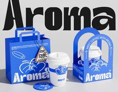 an advertisement for aroma coffee with blue bags and cups