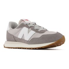 Complete her wardrobe with these New Balance 237 girls' shoes. Click this FOOTWEAR GUIDE to find the perfect fit and more! Complete her wardrobe with these New Balance 237 girls' shoes. Click this FOOTWEAR GUIDE to find the perfect fit and more! TECHNOLOGIES & FEATURES Gator inspired foxing and mudguard Oversized N logo Breathable design Foam footbed for all day comfort Bungee lace-up closure for easy on and offDETAILS Unbacked synthetic, unbacked nylon upper Polyester / mesh lining EVA midsole New Balance 237, N Logo, Shoe Size Chart, Men Shoes Size, Size 13, Girls Shoes, New Balance, Kids Shoes, Shoes Mens