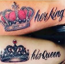 two people with matching tattoos on their arms, one has a crown and the other has a