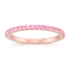 This utterly feminine wedding band features 19 round pavé-set pink sapphires at approximately .28 carat total weight. Each stone has been hand-selected for maximum color and sparkle. The ring is crafted from quality 14 karat rose gold. Pink Sapphire Wedding Band, Pink Sapphire Band, Rose Gold Lace, Feminine Wedding, Sapphire Wedding Band, Sapphire Band, Jewelry Catalog, White Gold Wedding Bands, Sapphire Wedding