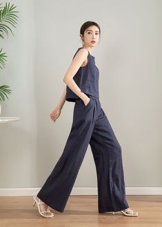 "This blue linen sleeveless top and wide leg pants set is perfect for the summer. The breathable and comfortable fabric will keep you cool all day long while the stylish design will make you stand out. Get ready to turn heads wherever you go in this chic set. DETAILS * 50% linen , 50% cotton * Two side pockets * Elastic waist detail * Linen set * Wide leg pants * Sleeveless top * Perfect for Summer, Spring * Wash by hand or machine with cold water, Ironing after dry * The model is 168cm (5′ 6″) Casual Sleeveless Linen Sets, Casual Blue Linen Set, Summer Linen Wide Leg Sets, High Waisted Linen Pants, Linen Sleeveless Top, Linen Outfit, Pants Linen, Fitted Coat, Wool Clothing