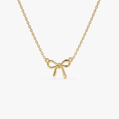 Discover the charm of our 14K Solid Gold Bow Ribbon Necklace, a minimalist design that symbolizes the tying of a knot. This elegant piece is perfect for bridesmaids, maids of honor, or your best friend, reflecting a bond of friendship and gratitude. Its sleek and simple bow design makes it an ideal birthday gift, offering a subtle yet beautiful addition to any jewelry collection. A thoughtful and stylish choice, this necklace serves as a memorable token for those closest to you. ▶ Details   * Made to Order  * Gold KT: 14K Solid Gold (also available in 18K & Platinum upon request)  * Length & Width: 10 x 7.75 MM * Ready to Ship in 1-2 Business Days ▶ See more of our Gold Necklaces - http://etsy.me/2lUxj86  ▶ See our storefront here - http://etsy.me/2lUcVnH  ▶ All store sections here  Diamon Gold Necklace With Bow For Gifts, Elegant Gold Necklace With Bow, Gold Dainty Bow Jewelry, Gold Bow Necklace, Elegant Bow Pendant Necklace, Ribbon Necklace, Bow Necklace, Gold Armband, Ruby Jewelry