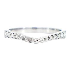 a white gold wedding band with diamonds on the sides and an elegant twist design in the middle