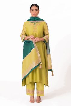 Lime green A-line kurta with embroidery along the neckline and sleeves. Paired with a pant and tissue applique work dupatta. - Aza Fashions Green Anarkali Palazzo Set With Embroidered Border, Green Palazzo Set With Embroidered Border For Eid, Designer Green Kurta With Embroidered Border, Designer Green Embroidered Kurta, Green Straight Kurta Sets With Embroidered Neckline, Festive Green Kurta With Embroidered Neckline, Green Sets With Embroidered Neckline, Green Straight Kurta With Embroidered Border, Green Embroidered Straight Kurta