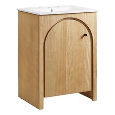 a wooden cabinet with a white sink on it's side and an arched door