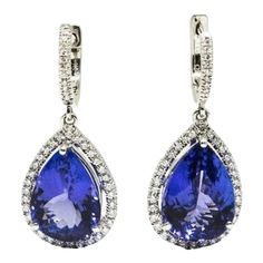 These 12.65 ct natural tanzanite earrings are a great addition to any wardrobe. Set in 18k white gold, they have 0.98 ct diamonds surrounding the stone. They are a must have for any fashionista. Tanzanite Diamond Earrings, Tanzanite Earrings, Tanzanite Diamond, Natural Tanzanite, Diamond Earrings, Dangle Drop Earrings, Dangle Earrings, Diamonds, White Gold