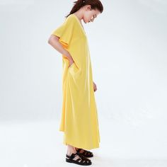 An oversized dress that can be worn backward and onward. A v-neck and square neck dress which can be worn in both ways with an a-line shape. The dress has side seam pockets and can be worn relaxed, or tied at the waist with a removable fabric belt. Made from 100% Lenzing® tencel. No8 is like a versatile blank canvas for us ready for artful accessorizing.  Designed and made in İstanbul, through an ethical, circular, certified and transparent supply chain. %100 Tencel™️ lyocell. Washine wash or dr Oversized V-neck Midi Dress For Daywear, Relaxed Fit V-neck Maxi Dress, V-neck Maxi Dress With Pockets For Daywear, Relaxed Fit V-neck Midi Dress, Spring V-neck Plain Dress, Plain V-neck Midi Dress For Summer, Plain V-neck Summer Midi Dress, Relaxed Fit Solid Color V-neck Maxi Dress, Oversized Solid V-neck Dress