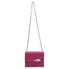 Rose Pourpre Hermes Mini Verrou Crossbody Bag. The Mini Verrou Crossbody Bag features a leather body, silver-tone hardware, a single chain-link shoulder strap, metal feet at bottom, and a front flap clasp closure. 6.75" L x 5.5" H x 2" D, 15.75" shoulder strap drop. Hermes Verrou, Luxury Wardrobe, Fashion Handbags, Purses Crossbody, Chain Link, Metallica, Crossbody Bag, Silver Tone, Shoulder Strap