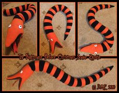 an orange and black striped snake made out of fabric