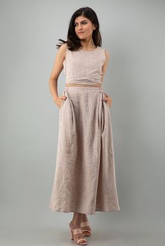 "DETAILS:- Includes Top and Skirt - Backless Top with Tie Belt Length 16\" | 41 cm - Sleeveless Crop Top - Soft linen Maxi Skirt length 36\" | 91 cm - Elasticated Back Waist Skirt with Side Pockets - Detailed with folds in front to provide more flare and decent look - 100% Lightweight Linen - Customization Available Check the link below for my shop ---------------------------------------- https://www.etsy.com/in-en/shop/Magicsilvercraft https://www.etsy.com/in-en/shop/PehroDesign --------------- Fitted Linen Wrap Skirt With Lining, Fitted Beige Linen Maxi Skirt, Cottagecore Wedding Dress, Crop Top And Maxi Skirt, Skirt Cottagecore, Wedding Dress Minimalist, Linen Tunics For Women, Cottagecore Wedding, Linen Dress Summer