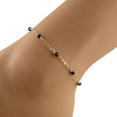 This elegant black crystal anklet features black Swarovski crystals and 14k gold filled chain and fastens with a 14k gold filled lobster clasp. An ideal companion to that little black dress! Please choose the size that you need from the drop-down menu, bearing in mind that the anklet should be approximately one inch larger than the size of your ankle. The anklet will arrive in an attractive gift box. Cheap Adjustable Black Beaded Anklets, Affordable Adjustable Black Beaded Anklets, Black Beaded Anklets, Cheap Black Festival Anklets, Silver Black Beads Anklets, Gold Chain Anklet, Black Anklet, Elegant Anklet, Delicate Gold Jewelry