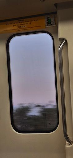 the view from inside a train window looking out