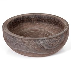 a wooden bowl sitting on top of a white table