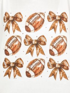 a white shirt with brown bows and footballs on it