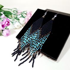 Blue Turquoise ,Matt Black and bronze color combination.Long tassel earrings. Beaded earrings. native American style .Fringe earrings .Seed Bead Earrings .Boho earrings . Materials;Sterling silver ear wire. High quality japanese beads 3 shades. This bead does not lose its color and does not darken. Earrings length 4.5 inches (11cm) You can see a large selection of earrings on my page https://www.etsy.com/il-en/shop/JewelryByElenaZar?ref=seller-platform-mcnav§ion_id=25458740 Bohemian Black Tassel Earrings With Round Beads, Black Bohemian Tassel Earrings With Round Beads, Bohemian Tassel Earrings With Black Beads For Gift, Bohemian Black Beaded Tassel Earrings Gift, Bohemian Black Tassel Earrings As Gift, Black Tassel Drop Earrings With Colorful Beads, Black Tassel Earrings With Colorful Beads For Gift, Black Bohemian Jewelry With Tassels, Black Bohemian Long Drop Earrings