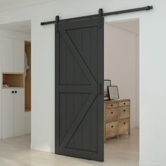 an open barn door in a white room