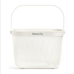 a white basket with the word grove co written on it in black lettering, sitting against a white background